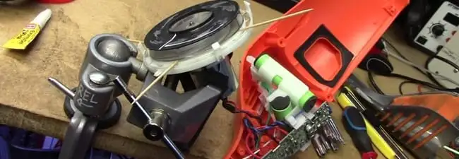 Vacuum cleaner repair parts and tools on a workbench in Stockton, CA